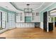 Bright living room with custom built-ins, hardwood floors, and large windows overlooking the yard at 608 Bellenden Dr, Peachtree City, GA 30269