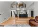 Spacious living room featuring wood floors, an open floor plan, and a staircase leading to the second floor at 608 Bellenden Dr, Peachtree City, GA 30269