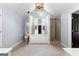 Spacious bathroom with large soaking tub, walk in shower, vanity with arched window for natural light at 608 Bellenden Dr, Peachtree City, GA 30269