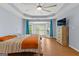 Spacious main bedroom featuring a trey ceiling, lots of natural light, and new floors at 608 Bellenden Dr, Peachtree City, GA 30269