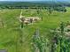 Vast green property featuring a well-maintained home surrounded by expansive fields and mature trees at 357 Old Driver Rd, Whitesburg, GA 30185