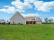 Expansive backyard showcasing the home's brick exterior and outdoor space at 357 Old Driver Rd, Whitesburg, GA 30185