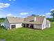 Aerial view of a large backyard featuring a brick home with a spacious patio area at 357 Old Driver Rd, Whitesburg, GA 30185