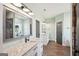 Bathroom with a walk in shower, soaking tub, double sinks, and subway tile at 357 Old Driver Rd, Whitesburg, GA 30185