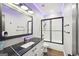 Modern bathroom featuring a white vanity with black countertop, subway tile shower, and updated fixtures at 357 Old Driver Rd, Whitesburg, GA 30185