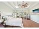 Spacious bedroom with tray ceiling, large windows, neutral carpet, and green walls at 357 Old Driver Rd, Whitesburg, GA 30185