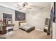 Cozy bedroom with carpet, decorative tapestry, ceiling fan, vanity, and ample natural light at 357 Old Driver Rd, Whitesburg, GA 30185