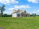 Charming property displaying a brick exterior, covered porch, and lush green lawn at 357 Old Driver Rd, Whitesburg, GA 30185