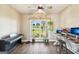 Bright home office with wood floors, decorated with green plants, and a large window with a green view at 357 Old Driver Rd, Whitesburg, GA 30185