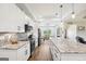 Beautiful kitchen with granite countertops, white cabinets, and stainless steel appliances at 357 Old Driver Rd, Whitesburg, GA 30185
