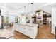Open floor plan with a large kitchen island flowing into the dining area and living room at 357 Old Driver Rd, Whitesburg, GA 30185