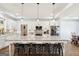 White kitchen with black appliances, granite countertops, brick backsplash and a center island at 357 Old Driver Rd, Whitesburg, GA 30185