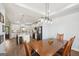 Open kitchen features white cabinets, brick backsplash, and an island with granite countertops at 357 Old Driver Rd, Whitesburg, GA 30185