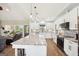 Updated kitchen featuring granite countertops, black appliances, and a large center island with seating at 357 Old Driver Rd, Whitesburg, GA 30185