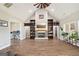 Welcoming living room featuring a cozy fireplace, built-in shelves, and natural light at 357 Old Driver Rd, Whitesburg, GA 30185