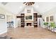 Inviting living room with a fireplace, built-in bookshelves, and wood-look tile flooring at 357 Old Driver Rd, Whitesburg, GA 30185