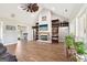 Inviting living room features a brick fireplace and a view of the kitchen and another room at 357 Old Driver Rd, Whitesburg, GA 30185