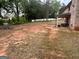 Large, expansive backyard with a covered back patio at 441 Lilywood Dr, Mcdonough, GA 30253