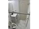 Compact bathroom showcases a modern vanity, toilet, and neutral-tone marble flooring at 441 Lilywood Dr, Mcdonough, GA 30253
