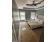 Cozy bedroom featuring a decorative tray ceiling, neutral walls and large windows at 441 Lilywood Dr, Mcdonough, GA 30253