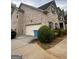 Exterior view of home with garage, lush landscaping, and side driveway at 441 Lilywood Dr, Mcdonough, GA 30253