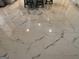 Close up of white marble tile flooring under the kitchen island at 441 Lilywood Dr, Mcdonough, GA 30253