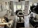 Comfortable living room with hardwood floors, grey walls, full seating, tv and bar area at 441 Lilywood Dr, Mcdonough, GA 30253