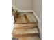 Close up of unfinished stairs with white trim; new owners can customize the flooring at 441 Lilywood Dr, Mcdonough, GA 30253