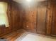 Bedroom with paneled walls and hardwood floors at 5780 Hill Rd, Powder Springs, GA 30127