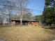 Cozy, one-story home with a long front porch situated on a spacious lot at 5780 Hill Rd, Powder Springs, GA 30127