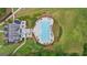 An aerial shot features a large rectangular pool surrounded by lounge chairs, landscaping, and a multi-story house at 266 Blue Point Pkwy, Fayetteville, GA 30215