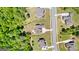Aerial view showcasing the property's landscaping, mature trees, and its location within a well-maintained neighborhood at 266 Blue Point Pkwy, Fayetteville, GA 30215