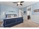 Bright bedroom with blue walls, carpet floors and a king sized bed at 266 Blue Point Pkwy, Fayetteville, GA 30215