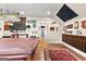 Hardwood floors and decorated walls with a pool table are focal point of billiard room at 266 Blue Point Pkwy, Fayetteville, GA 30215