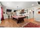 Billiard room featuring hardwood floors, a pool table, and a TV at 266 Blue Point Pkwy, Fayetteville, GA 30215