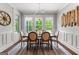 Charming dining room with elegant chandelier and wainscoting at 266 Blue Point Pkwy, Fayetteville, GA 30215