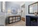 Bright hallway with soft blue walls, wainscoting, decorative table and lamp at 266 Blue Point Pkwy, Fayetteville, GA 30215