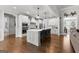 Modern kitchen with white cabinets, stainless steel appliances, and a large island at 266 Blue Point Pkwy, Fayetteville, GA 30215