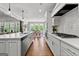 Bright kitchen featuring white cabinets, stainless appliances, and hardwood floors at 266 Blue Point Pkwy, Fayetteville, GA 30215