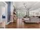 Spacious living room featuring a stone fireplace, hardwood floors, and large windows at 266 Blue Point Pkwy, Fayetteville, GA 30215