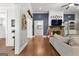 Spacious living room with hardwood floors, stone fireplace and large wall-mounted television at 266 Blue Point Pkwy, Fayetteville, GA 30215