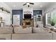 Comfortable living room featuring a stone fireplace and cozy furnishings at 266 Blue Point Pkwy, Fayetteville, GA 30215