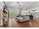 Bright living area with stone fireplace, hardwood floors, and open concept layout at 266 Blue Point Pkwy, Fayetteville, GA 30215