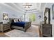 Main bedroom with tray ceiling, natural light, and elegant furniture at 266 Blue Point Pkwy, Fayetteville, GA 30215