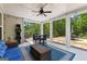 Covered patio featuring comfortable seating, string lights, and an outdoor dining area, perfect for relaxation and gatherings at 266 Blue Point Pkwy, Fayetteville, GA 30215