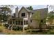 Two-story home featuring a screened-in porch and stairs leading to the back yard at 250 Clearview Cir, Mcdonough, GA 30253