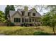 Two-story house with a screened-in porch and stairs down to the yard at 250 Clearview Cir, Mcdonough, GA 30253