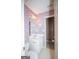 Bathroom featuring a toilet, sink, and decorative wallpaper at 250 Clearview Cir, Mcdonough, GA 30253