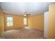 Spacious bedroom with two windows, a ceiling fan, and yellow walls at 250 Clearview Cir, Mcdonough, GA 30253
