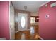 Foyer featuring hardwood floors and a white front door, opening into the home at 250 Clearview Cir, Mcdonough, GA 30253